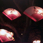 Fan lanterns hang in the trees