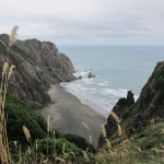 Inaccessible cove beneath the bluffs north of Karekare