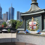 Motto of Melbourne on St. Kilda bridge over the Yarra, "She gains strength as she goes."