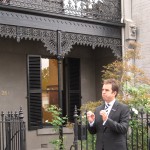 An auctioneer working hard to sell a Carlton home