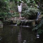 A grotto in parkland amid the highways