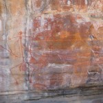 Stylized stick figure on an overpainted rock face, Kakadu