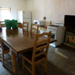 Inside cozy Mays Cottage, with the wood stove