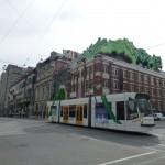 Green slime tops a vintage building on Swanston