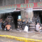 Workers assemble gizmos from a potpourri of metal parts, Chinatown