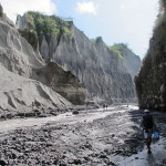 Trekking thru streams running down the lava channel of Pinatubo