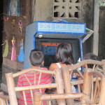 Children playing arcade games at Moalboal "convenience" store
