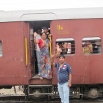 Family waves bye from the train, Aravali Hills