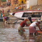 Laundrymen cleaning in the Ganges