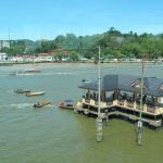 Powered long boats line up for passengers at Kampung Ayer, Brunei