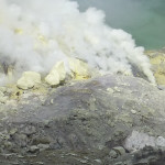 Workers amid the sulfur plumes at Ijen