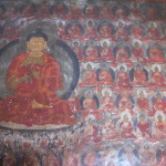 Repetitive Buddha images on temple wall