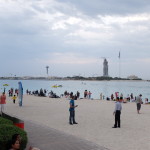 The Corniche Beach in the evening with Marina Mall across the bay