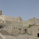 Bahla Fort looms above the old mud hut village